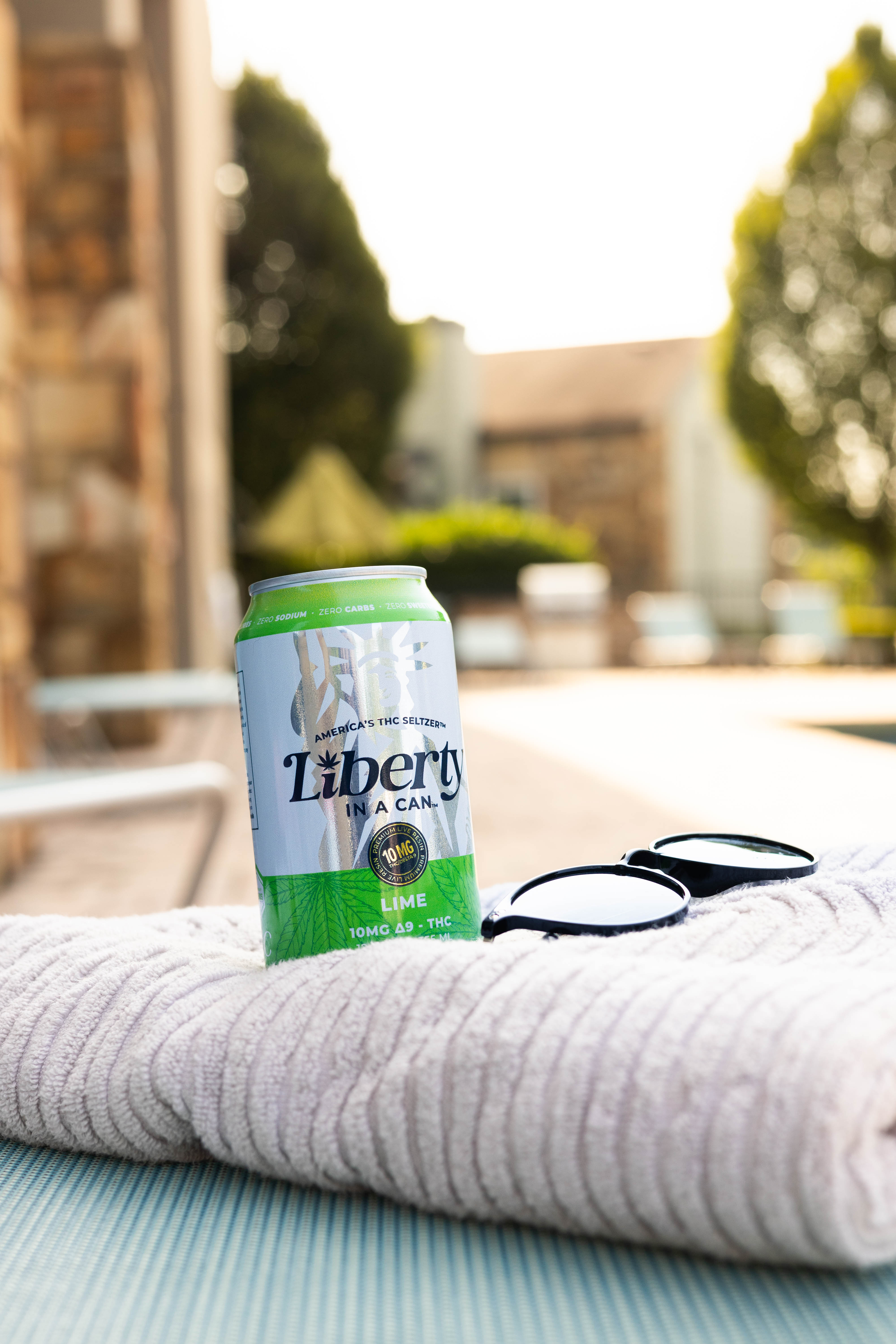 Liberty In a Can™ 5mg Lime THC Seltzer poolside in Delray Beach, Florida